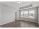 Light-filled bedroom featuring wood floors and large windows at 111 Hickory Plains Rd, Knightdale, NC 27545
