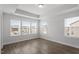 Bedroom with hardwood floors, neutral walls, and two large windows at 111 Hickory Plains Rd, Knightdale, NC 27545