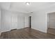 Bright bedroom features wood floors, two closets and neutral paint at 111 Hickory Plains Rd, Knightdale, NC 27545