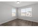 Spacious bedroom with hardwood floors, neutral walls, and abundant natural light at 111 Hickory Plains Rd, Knightdale, NC 27545
