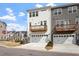 Contemporary townhomes featuring private garages, charming balconies, and landscaped surroundings at 111 Hickory Plains Rd, Knightdale, NC 27545