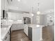 Modern kitchen with white cabinetry, an island, and stainless steel appliances at 111 Hickory Plains Rd, Knightdale, NC 27545