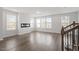 Bright living room features recessed lighting, modern fireplace and large windows at 111 Hickory Plains Rd, Knightdale, NC 27545