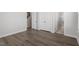 Spacious main bedroom featuring a walk-in closet, and ensuite bath with modern flooring at 111 Hickory Plains Rd, Knightdale, NC 27545