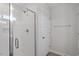 Modern bathroom with glass enclosed shower and white tile at 111 Hickory Plains Rd, Knightdale, NC 27545