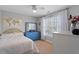 Light filled bedroom with a blue dresser and a ceiling fan, with a view to a map at 11342 Oakcroft Dr, Raleigh, NC 27614