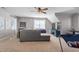 Large bonus room with a sofa, TV, ceiling fan, and a wall decor and window at 11342 Oakcroft Dr, Raleigh, NC 27614