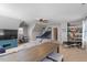 Spacious bonus room features carpet, a ceiling fan, a large TV, and fun recreational activities at 11342 Oakcroft Dr, Raleigh, NC 27614