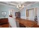 Elegant dining room with coffered ceiling, chandelier and hardwood floors at 11342 Oakcroft Dr, Raleigh, NC 27614