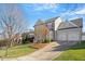 Beautiful two-story home with well-manicured lawn and long driveway leading to a two-car garage at 11342 Oakcroft Dr, Raleigh, NC 27614
