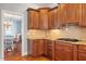 Well-appointed kitchen with granite counters, wood cabinets, and stainless steel appliances at 11342 Oakcroft Dr, Raleigh, NC 27614