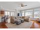 Spacious living room with hardwood floors, neutral decor, and an open layout connecting to the dining area at 11342 Oakcroft Dr, Raleigh, NC 27614