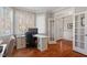 Bright office with large windows, hardwood floors, and custom built-in desk at 11342 Oakcroft Dr, Raleigh, NC 27614