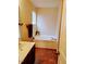 Standard bathroom featuring a bathtub, and a single sink with dark wood cabinets at 1141 Early Rise St, Raleigh, NC 27610