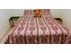 Bedroom featuring a decorated queen-size bed with matching pillows and throw blanket at 1141 Early Rise St, Raleigh, NC 27610