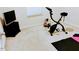 A spare room with a stationary bike, TV, and some workout equipment at 1141 Early Rise St, Raleigh, NC 27610