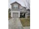 Charming two-story home featuring a covered entryway, a one car garage and classic shutters at 1141 Early Rise St, Raleigh, NC 27610