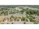 Aerial view of a neighborhood, showcasing a lake and well-maintained homes at 121 Stone Nut Trl, Fuquay Varina, NC 27526