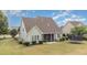 A spacious backyard features a screened in porch and room for activities at 121 Stone Nut Trl, Fuquay Varina, NC 27526