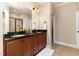 Elegant bathroom with double vanity, granite countertops, and a glass-enclosed shower at 121 Stone Nut Trl, Fuquay Varina, NC 27526