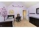Cozy purple bedroom with stylish decorations and carpeted flooring for added comfort at 121 Stone Nut Trl, Fuquay Varina, NC 27526