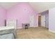Spacious purple bedroom with carpet, vaulted ceiling, and plenty of room to relax at 121 Stone Nut Trl, Fuquay Varina, NC 27526