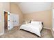Neutral bedroom featuring vaulted ceilings, plush carpet, and an abundance of natural light at 121 Stone Nut Trl, Fuquay Varina, NC 27526