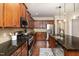 Modern kitchen equipped with stainless appliances, granite countertops, and ample cabinet space at 121 Stone Nut Trl, Fuquay Varina, NC 27526