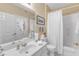 Clean bathroom with white vanity, white tile floors, and shower tub combo at 1700 Tiffany Bay Ct # 303, Raleigh, NC 27609