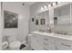Modern bathroom featuring double sinks, stylish mirrors, and sleek white cabinetry at 1700 Tiffany Bay Ct # 303, Raleigh, NC 27609