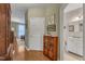 View of hall with hardwood floors, leading to the living room and bathroom at 1700 Tiffany Bay Ct # 303, Raleigh, NC 27609