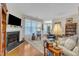 Bright living room featuring a fireplace, hardwood floors, and a cozy seating area with natural light at 1700 Tiffany Bay Ct # 303, Raleigh, NC 27609
