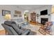Comfortable living room with a fireplace, hardwood floors, and a cozy seating area with natural light at 1700 Tiffany Bay Ct # 303, Raleigh, NC 27609
