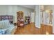 View of living room with hardwood flooring and access to the bathroom at 1700 Tiffany Bay Ct # 303, Raleigh, NC 27609