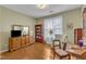 Bright living room with hardwood floors, large window and comfortable seating at 1700 Tiffany Bay Ct # 303, Raleigh, NC 27609