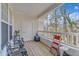 Cozy porch with seating, offering a relaxing outdoor space with view of the wooded area at 1700 Tiffany Bay Ct # 303, Raleigh, NC 27609