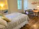 Bright bedroom with hardwood floors, a window view, and a cozy, relaxing atmosphere at 1704 Delaware Ave, Durham, NC 27705