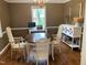 Formal dining room featuring a chandelier, computer desk, and elegant decor at 1704 Delaware Ave, Durham, NC 27705