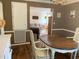 Dining room with a table and chairs open to the living area for seamless entertaining at 1704 Delaware Ave, Durham, NC 27705