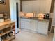 Traditional kitchen featuring white cabinets, stainless steel sink, and plenty of countertop space at 1704 Delaware Ave, Durham, NC 27705