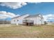 Expansive backyard view from rear of the home, featuring a nice deck, and spacious grassy area at 174 Arrow Ln, Middlesex, NC 27557