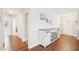 Entryway features beautiful wood floors and ample storage space with a rustic white storage cabinet at 174 Arrow Ln, Middlesex, NC 27557