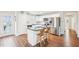 Well-lit kitchen with granite countertop island and stainless steel appliances at 174 Arrow Ln, Middlesex, NC 27557