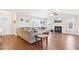 Bright living room with wood floors, fireplace, and large sectional sofa at 174 Arrow Ln, Middlesex, NC 27557