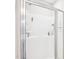 Contemporary shower featuring glass doors, wall-mounted shower head and handheld sprayer at 174 Arrow Ln, Middlesex, NC 27557