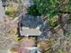 A cozy home is nestled among lush trees and vegetation and boasts a private outdoor deck at 1821 Kelly Glen Dr, Apex, NC 27502