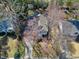 Charming home with mature landscaping, a long driveway, and a covered front porch at 1821 Kelly Glen Dr, Apex, NC 27502