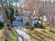 Charming home with mature landscaping, a long driveway, and a covered front porch at 1821 Kelly Glen Dr, Apex, NC 27502
