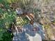 Aerial view showcasing a private backyard, spacious deck, and lush greenery at 1821 Kelly Glen Dr, Apex, NC 27502