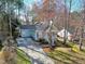 Charming home with mature landscaping, a long driveway, and a covered front porch at 1821 Kelly Glen Dr, Apex, NC 27502